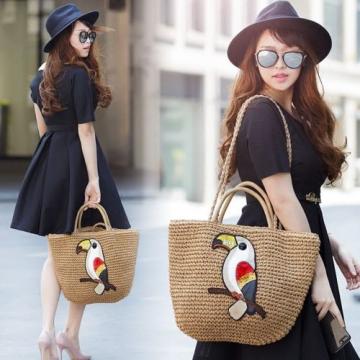 Women&#039;s handmade woven summer straw bag with parrot bird swan owl embroidery