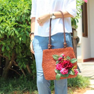 Women&#039;s handmade woven straw bag handbag with flower leaves berries blossoms