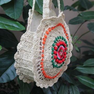 Women&#039;s handmade round straw bag handbag with pom poms and embroidery