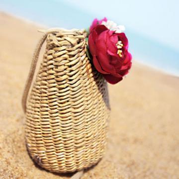 Women handmade woven summer beach mini straw bag with flowers leaves blossoms