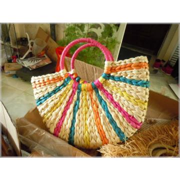 Women&#039;s handmade woven summer beach round straw bag with rainbow ray design