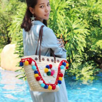 Women&#039;s handmade summer beach straw bag handbag with pom poms tassels shells