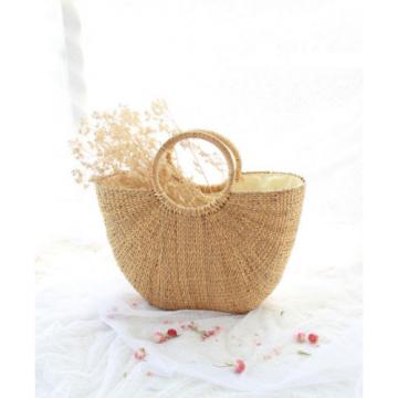 Women&#039;s handmade boho bohemian summer beach round straw bag with round handles