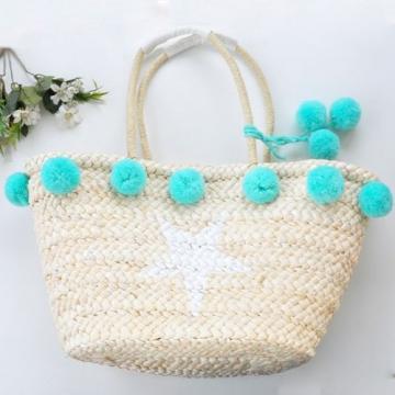 Women&#039;s handmade summer beach big straw bag with pink mint pom pom star print