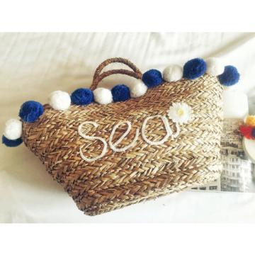 Women&#039;s handmade woven straw summer beach bag with pom pom sequin Sea flower