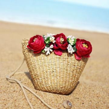 Women handmade woven summer beach mini straw bag with flowers leaves blossoms