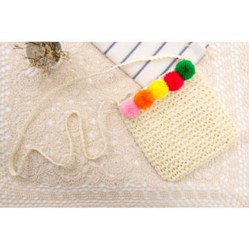 Women&#039;s handmade summer beach small straw cross body bag with colorful pom poms