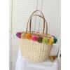 Women&#039;s handmade summer beach woven straw bag with colorful pom poms