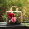 Women&#039;s handmade summer beach straw bag with rose flowers berries blossoms