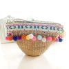 Women&#039;s handmade woven summer beach mini straw bag with pom pom beads tassels