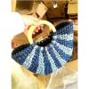 Women&#039;s handmade summer beach round woven straw bag with wooden handles