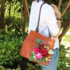 Women&#039;s handmade woven straw bag handbag with flower leaves berries blossoms