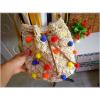 Women&#039;s handmade crochet straw cross body bag bucket handbag with pom poms coins