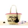 Women&#039;s handmade woven summer beach straw bag with pom poms emboridery tassel