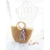 Women&#039;s handmade boho bohemian summer beach round straw bag with round handles