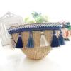 Women&#039;s handmade woven summer beach mini straw bag with pom pom beads tassels