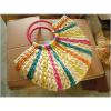 Women&#039;s handmade woven summer beach round straw bag with rainbow ray design