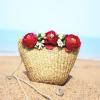 Women handmade woven summer beach mini straw bag with flowers leaves blossoms